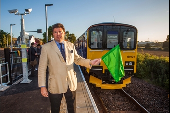 Cllr Leadbetter waving off the first service